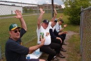 John Melanson leads the A's bench.